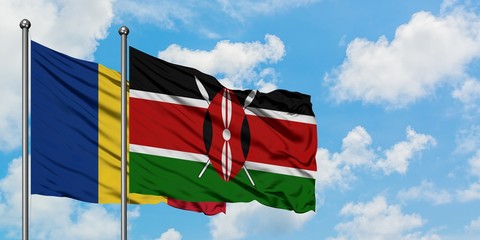 Romania and Kenya flag waving in the wind against white cloudy blue sky together. Diplomacy...