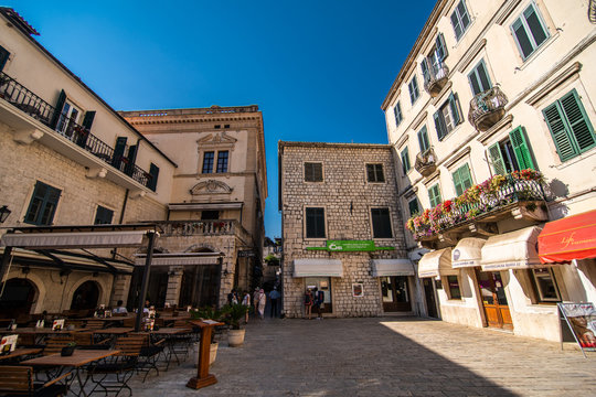 KOTOR, MONTENEGRO - JULY 2019: View on a small square in old town in Kotor, Montenegro. Kotor is town on coast of Montenegro and located on the Bay of Kotor