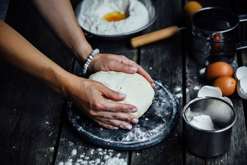 woman washing hands in kitchen