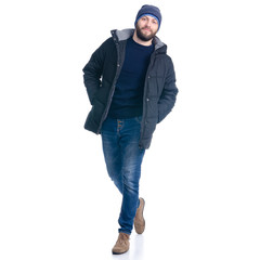 Naklejka premium Man in winter jacket and warm hat walking goes