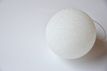 white Christmas ball on white background. Christmas toy. Merry Christmas and happy New Year.