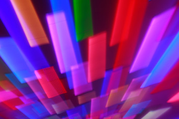 Blurred bright neon lines background. Colourful lights in motion. Abstract background with neon effects, speed theme.