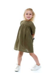 Cute little girl in a light summer dress.