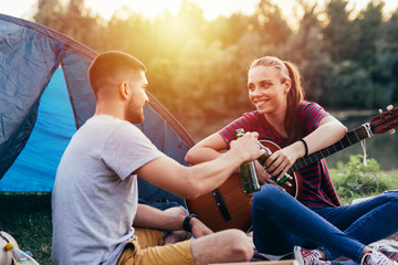 happy couple on camping by the river outdoor