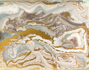Pastel marble pattern with golden glitter. Abstract liquid background