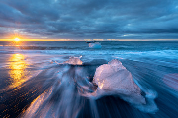 little Icebergs at sunrise in Jokulsarlon glacial lagoon. Vatnajokull National Park, southeast...