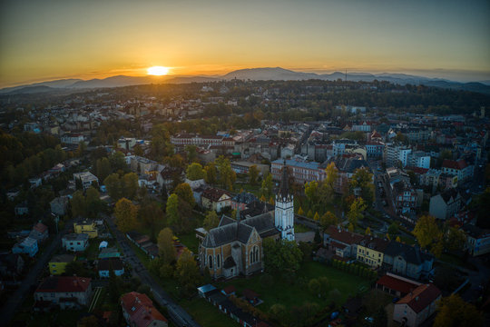 aeria shot of sunrise sun through the city of cesky tesin , poslky tesin 