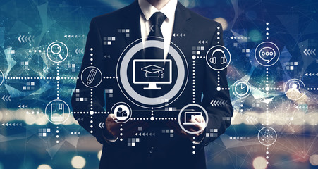 E-learning concept with businessman holding a tablet computer