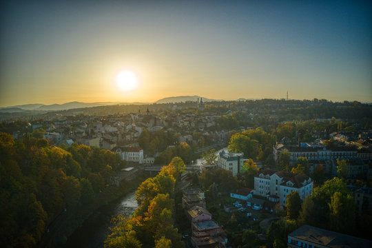 aeria shot of sunrise sun through the city of cesky tesin , poslky tesin 