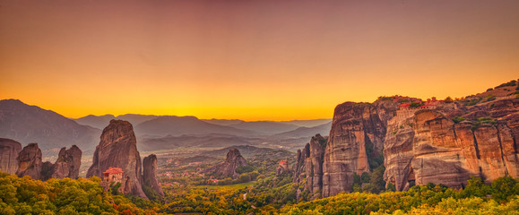 Landscape with monasteries and rock formations in Meteora, Greece. during sunset.