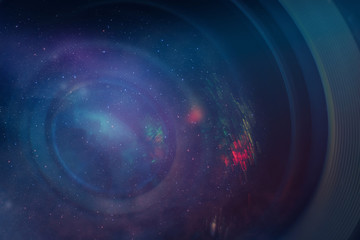 Beautiful abstract camera lens background multi colored glass reflection. Nebula dust in infinite...