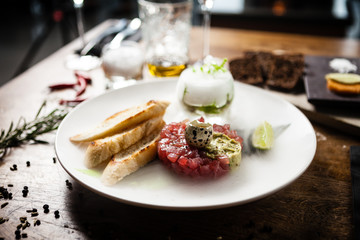Tuna tartare served on a plate in restaurant