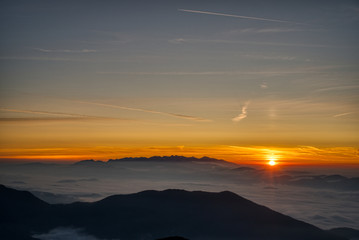 Fototapeta premium Mist flood the valley and mountains at the beautiful sunrise, slovakia, great rozutec