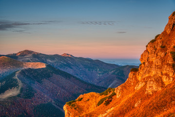 Obraz na płótnie Canvas mountains illuminated at sunrise