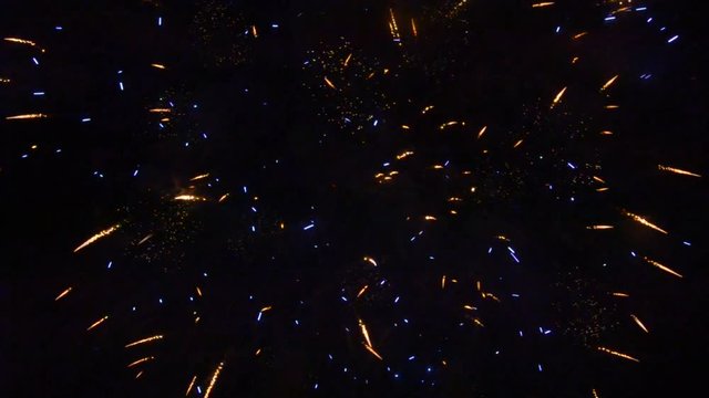 Colorful fireworks that explode and fill the darkness of the night sky with colored light