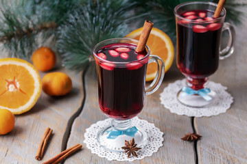 Two glasses of Scandinavian mulled wine Glogg garnished with stick  of cinnamon and almonds. Winter time. Holiday concept. New Year, Christmas drink. 