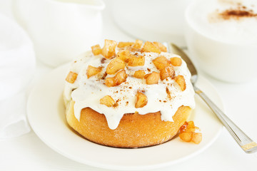 Homemade cakes, cinnamon rolls and icing.