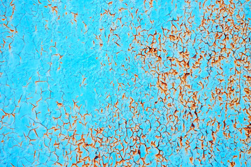 Design background the rust on the steel plate is painted in blue. Texture old sheet metal rusted. Conceptual photo of rust peeping through the paint. Old rusty painted metal.