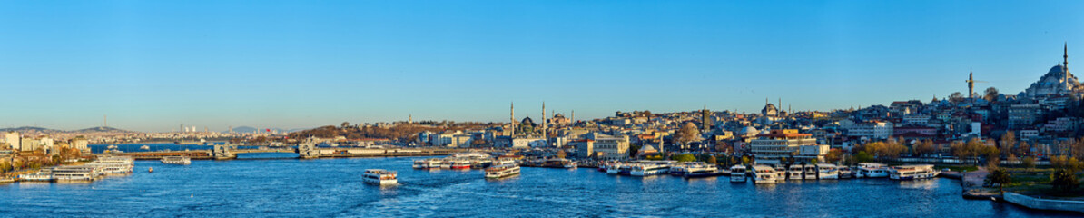 Fototapeta na wymiar Istanbul, Turkey - 1 April, 2017: Panorama of Cityscape of Golden horn with ancient and modern buildings