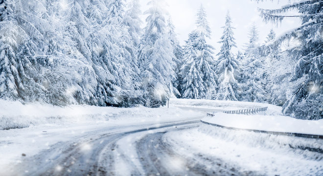 Winter beautiful snowy road snow or landscape forest and trees covered with snow in background.