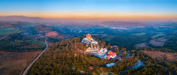 Top view Aerial photo from flying drone.The beautiful  of Thai temple (Wat Pa Phu Hai Long) on the...