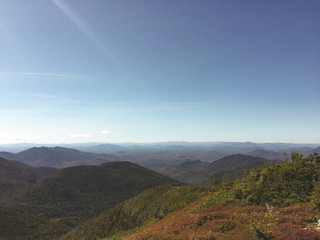 Fototapeta premium View of Adirondack Mountains and High Peaks on countryside, beautiful organic farmstead with stunning view, hiking in the Mountains, Healthy lifestyle , Mountains at sunset, perfect lighting on peaks