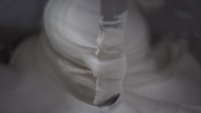 Closeup Of Kneading Machine Bread Maker Mixing Organic Dough To Make Bread, Biscuits, Sweets, Cake Or Pizza. Food Concept.