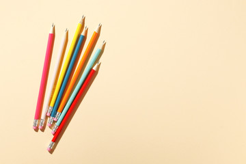 color pencils on a pink background. Place for text.