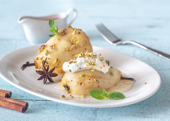 Poached pears on the white plate