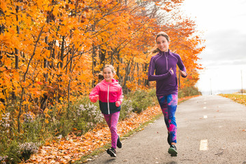 The Healthy lifestyle girl running in park on autumn season