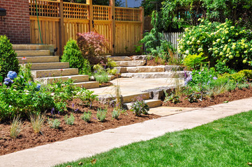 Huge natural stone slab steps create a beautiful urban front garden, and a safe transition to a...