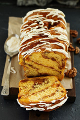 Homemade cakes, cinnamon rolls and icing.