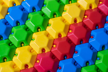 Plastic colorful puzzle constructor. Can be used as a colorful background