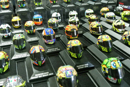 KUALA LUMPUR, MALAYSIA -JULY 30, 2018: Selected focused of the miniature model of MotoGP riders helmets arranged on the table. Displayed by the collector. 
