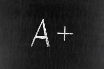 A plus grade mark on chalk board
