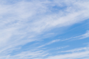 White fluffy clouds in the blue sky in summer