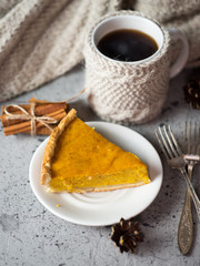 Traditional American thanksgiving pumpkin pie and coffee mug