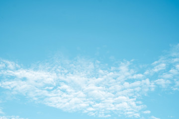 Naklejka na ściany i meble Abstract white cloudy on blu sky background with copy space