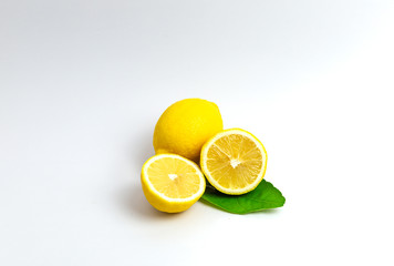 Lemon slices and leaves isolated on a white background