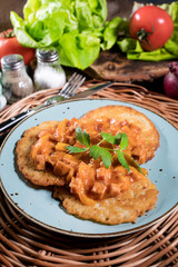 Homemade potato pancakes with goulash.