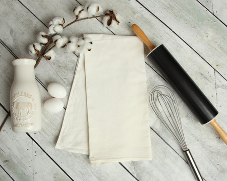 Blank flour sack kitchen towel mockup photo on a farmhouse rustic background