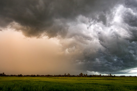 Dark sky and dramatic black cloud before rain.A tropical cyclone is a rapidly rotating storm system characterized by a low-pressure center, a closed low-level atmospheric circulation, strong 