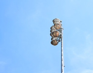 Spotlights on blue sky background.