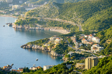Fototapeta na wymiar Budva coastlingon the adriatic coastline with budva old town and sveti stefan from an aerial perspective