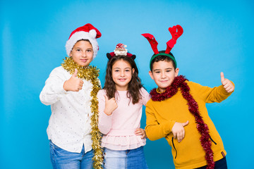 Kids celebrating crhistmas day doing expressions