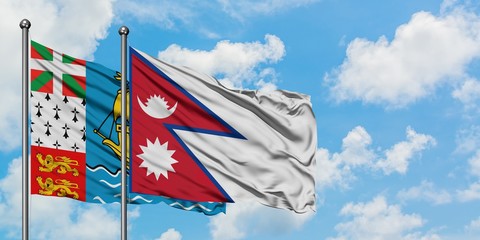 Saint Pierre And Miquelon and Nepal flag waving in the wind against white cloudy blue sky together. Diplomacy concept, international relations.