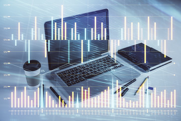 Forex graph hologram with desktop office computer background. Double exposure. Concept of financial analysis.