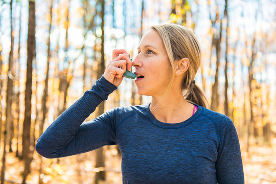 A Fitness running woman in winter season asthma suffer