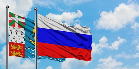 Saint Pierre And Miquelon and Russia flag waving in the wind against white cloudy blue sky together. Diplomacy concept, international relations.