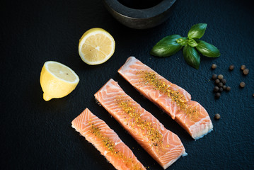 Fresh fish. Salmon fillet on black.